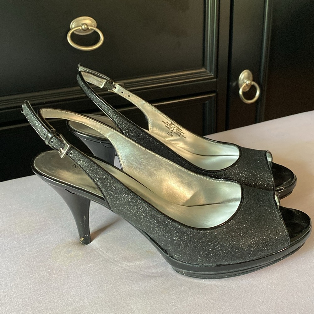 Black open top, sling back heels.